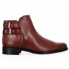 Burgundy all-leather ankle boot with studded sole and ankle straps.