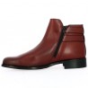Burgundy all-leather ankle boot with studded sole and ankle straps.