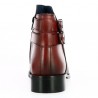 Burgundy all-leather ankle boot with studded sole and ankle straps.