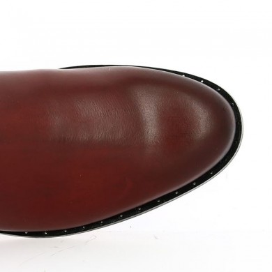 Burgundy all-leather ankle boot with studded sole and ankle straps.