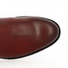 Burgundy all-leather ankle boot with studded sole and ankle straps.